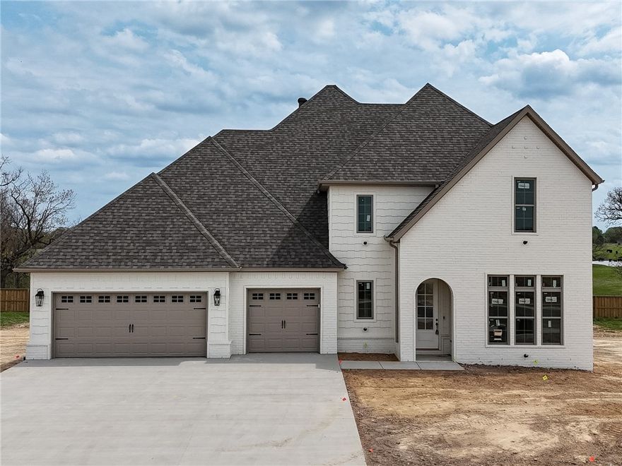 Welcome to County Line Square, a new Springdale community near Shaw Family Park with a pool and pavilion for residents. The Fairview opens into the main living area, creating an inviting first impression. The living space features a fireplace and 3 large windows. From here, the layout flows into the dining area and kitchen, with French doors leading to the covered back patio. The kitchen includes a large island, quartz countertops, and cabinets to the ceiling. Engineered hardwood floors run throughout the first floor. A bedroom sits toward the back of the home with a full bathroom nearby. The primary suite features a vaulted ceiling, a bathroom with a double vanity and centered makeup vanity, a walk-in shower, and a walk-in closet that connects to the laundry room. A mudroom and 3-car garage are also located on the main level. Upstairs offers 3 bedrooms and a full bathroom. A fence, blinds, and gutters are included. Builder’s preferred lender is offering $3500 toward closing costs or a rate buy down. *Agent Owned*