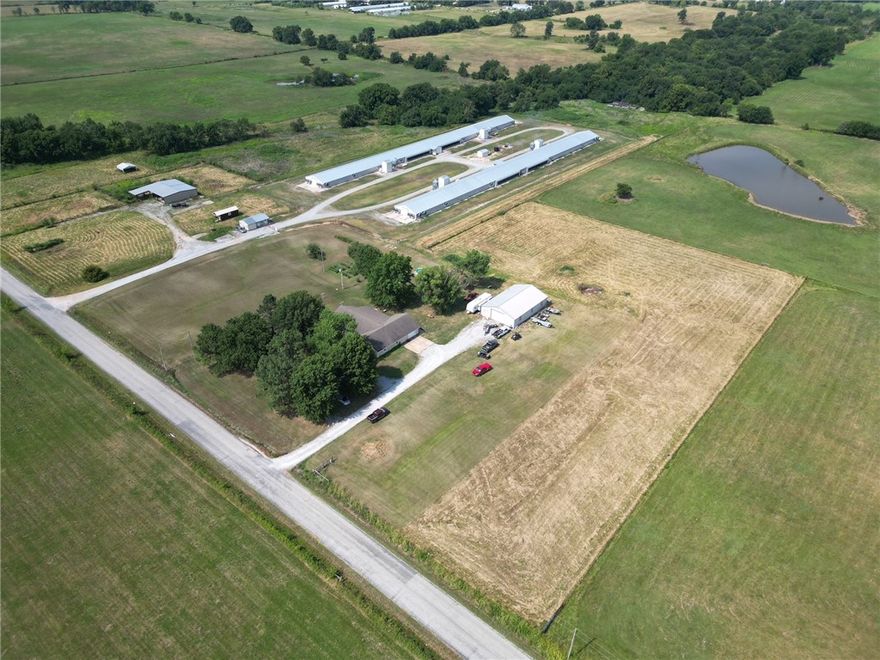 Incredibly located income producing farm on 25 acres. Egg farm with great income located a few miles from town on pavement with all the luxuries. 2 house farm fully rebuilt in 2017 with Cobb contract. Beautiful 4 bedroom 3 bath home with with formal dining , fireplace, split floorplan and large shop with living quarters. This is an incredible opportunity for country life that pays the bills. Well and rural water.