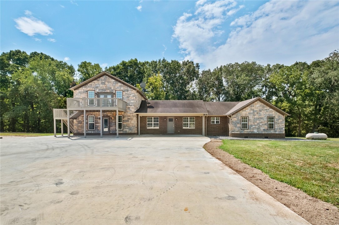 Welcome to paradise! This estate offers 30 + or - acres with large home with and inground saltwater pool. Would make a great horse or cattle operation with stalls connecting to the shop. The pool is heated as well for a longer swim season. Upstairs could be used as a bedroom or a large entertainment area with balconies on the front and back. The home has been updated with a huge walk-in shower in the master that also has the soaker tub. Home is wired for sound system.