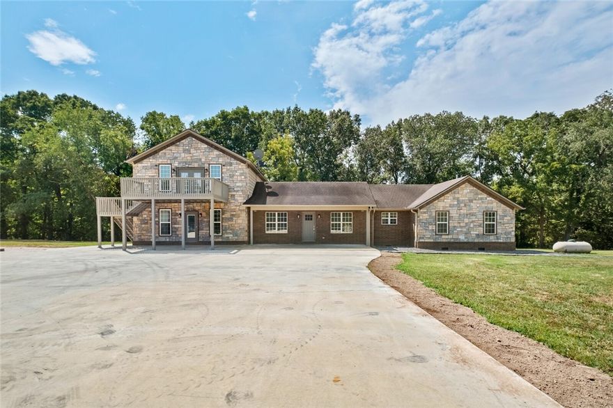 Welcome to paradise!  This estate offers 30 + or - acres with large home with and inground saltwater pool.  Would make a great horse or cattle operation with stalls connecting to the shop.  The pool is heated as well for a longer swim season.  Upstairs could be used as a bedroom or a large entertainment area with balconies on the front and back.  The home has been updated with a huge walk-in shower in the master that also has the soaker tub.  Home is wired for sound system.