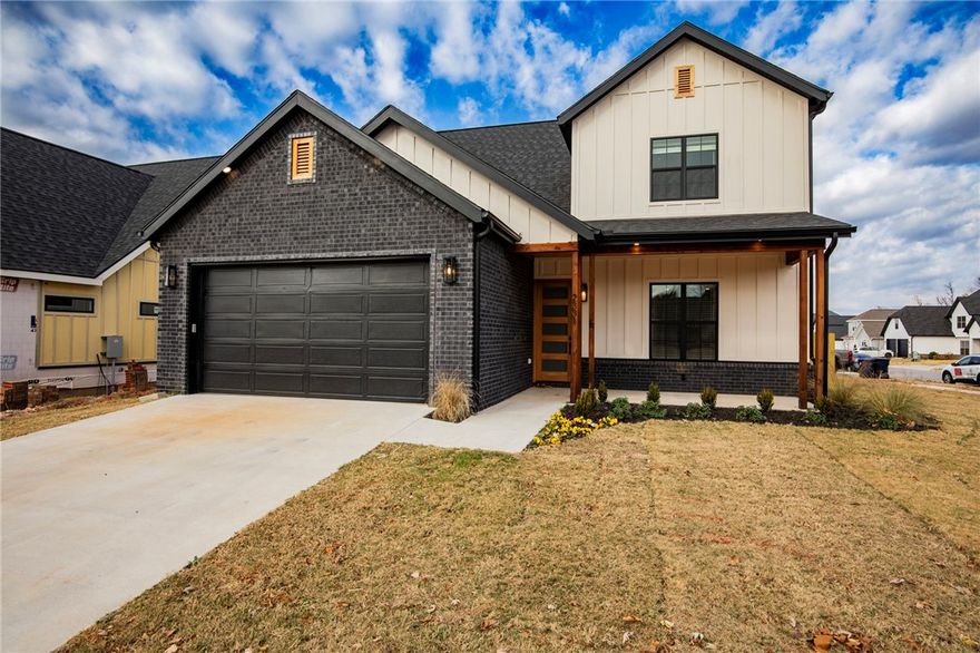 $3500 preferred lender credits! Fabulous new construction near the Promenade and Rogers Aquatic Center!
These elevated homes showcase stunning design with white oak flooring, high-end countertops, and designer tile selections throughout. Vaulted ceilings and floor-to-ceiling cabinetry create a grand, open feel, while the butler’s pantry, with counters and outlets, keeps your gorgeous kitchen clutter-free.
The primary suite is a true retreat, featuring a spa-like bath with a frameless glass shower wrapped in floor-to-ceiling tile, and dual vanities. The spacious walk-in closet offers custom shelving, drawers, and hanging space for ultimate organization. Upstairs, you’ll find three additional bedrooms and a full bath with the same elevated finishes, plus one room easily doubles as a bonus living area.
Outside, enjoy full sod, front landscaping, and a private backyard with a gate and wood privacy fence!