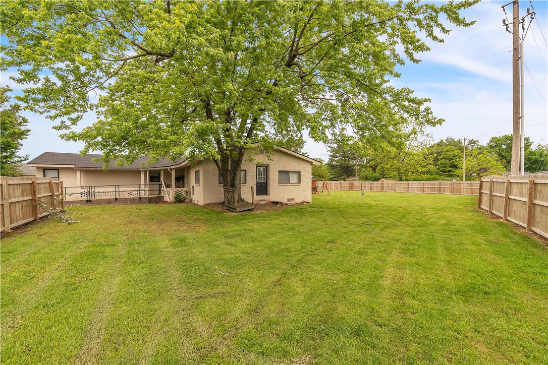 Spacious 5-bedroom, 2.5-bath home with endless potential! Whether you're looking for a roomy residence or a property for institutional use, this one has it all. Zoned P-1 (Institutional District), this home allows for various uses including a nursery school, dormitory, church, or health care clinic. Inside, enjoy a generous living room and an open-concept kitchen perfect for gatherings. Cabinets recently updated. Two sets of washers and dryers convey with the property. Handicap-accessible ramp provides added convenience. Outside features include a newly fenced large yard and a 10x10 storage shed. A $10,000 credit will be offered at closing for a sewer repair needed. Total acreage is 1.46. Lots of room for outdoor activities! Note: Security cameras are leased and will not convey.
