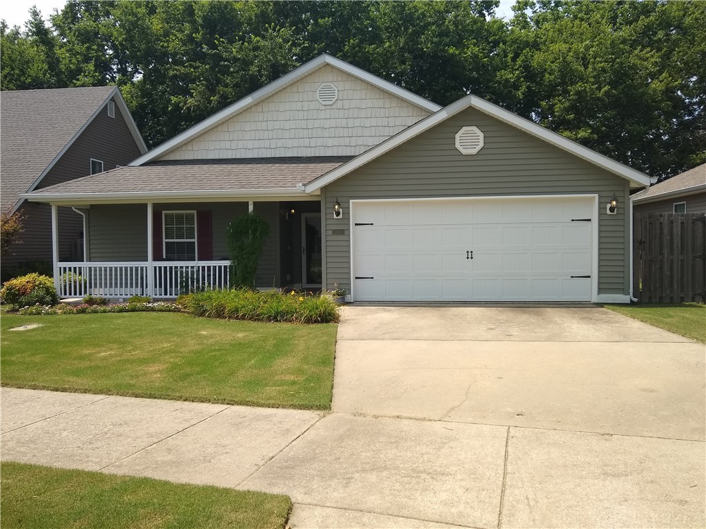 This was the model home for the Walnut Crossing Subdivision. The seller is the 2nd owner of this property. The amenities include laminate wood floors in the living room, ceramic tile in the kitchen, bathrooms, hallway and carpet in the bedrooms. There are walk-in closets in all three bedrooms. The fireplace in the living room is gas log. Washer & Dryer convey but the refrigerator does not. As this was the model the garage is heated and insulated. The front of the property is manicured and the rear is an absolute oasis. Large trees surround the rear of the property and the rest features a park like setting.