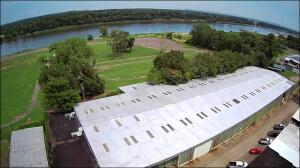 This is a rare find on the Arkansas River with 11 acres and 52,000 plus sq ft building. Sq footage includes 38,196 warehouse space with dirt floor and the remainder could be used for retail or any other commercial endeavors you would like to pursue. The possibilities are endless.