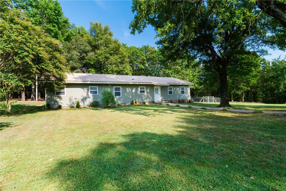 Welcome to your peaceful retreat! This one-owner 3 bedroom, 2 bath home sits on approximately 22 acres, offering the perfect blend of comfort, space, and serenity. Thoughtfully maintained, the home features solar panels for energy efficiency and a safe room for added peace of mind. Step outside to enjoy wide open skies, fresh air, and the beauty of natureāit's not uncommon to spot deer and other wildlife right from your yard. Whether you're dreaming of a hobby farm, weekend getaway, or a quiet place to call home, this property offers the relaxing lifestyle you've been looking for.