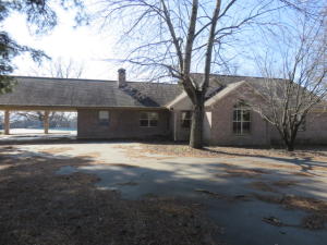 FOR THE VACATION OF YOUR LIFETIME-- Phenomenal 11+/- acre hobby farm! Includes 15,000 sq. ft shop w/office & bathroom. Separate elect. meter & septic system.Another 1,800 sq. ft shop with heated concrete slab floor (Hydronic system). Small barn & cattle chutes, feed bin. 2 ponds, fenced and cross fenced acreage. Home features 2 family rooms,3.5 bathrooms, 4 bedrooms, instant hot water, a storm cellar accessed from the interior, mother in law suite. Bonus storage rooms! Concrete, inground pool and pool house changing rooms/storage. Conveys by SPECIAL WARRANTY DEED. Sells as is, where is, all faults basis. No warranties, express or implied. Arvest employees, directors, and their family members are ineligible to purchase Arvest's bank-owned properties. (Only active utility is electricity.