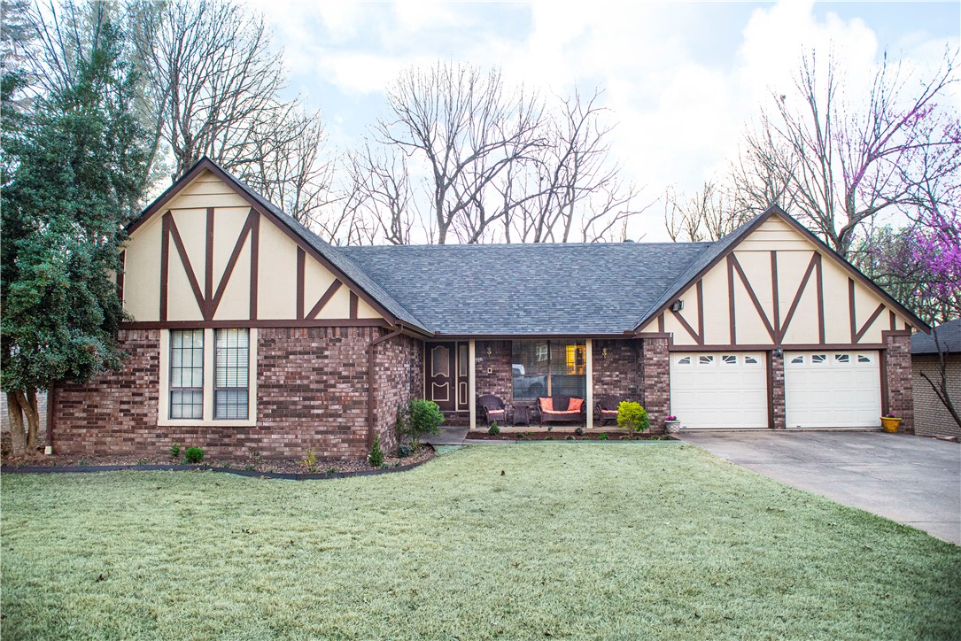 Wonderful Tudor Style home with lots of updates ! Remodeled kitchen includes granite counters, oven, dishwasher & backsplash . Newer roof & AC system in 2022 Updated electrical wiring . Home also features 2 large living areas, formal dining area & 3.5 baths . Lots of natural wood finished through-out . Both living areas have brick walled fireplaces . Main living room features vaulted beamed ceiling .
Enjoy early mornings on covered 9 X 28 deck. Home is just minutes to JB Hunt Park & Razorback Greenway !