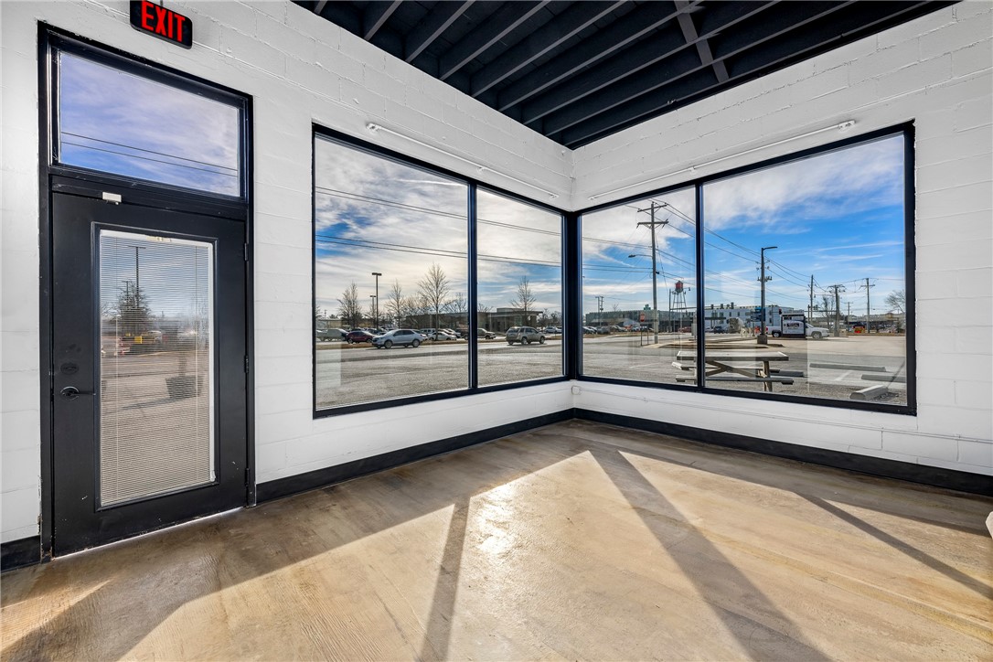 Endless possibilities await at this prime location! Situated directly across from Harp’s and just a block from Locust St (Hwy 12), this C2-zoned corner lot boasts incredible visibility and a high-traffic count—ideal for a wide range of businesses or a smart investment opportunity.
Plus, the Razorback Greenway is less than half a block away, providing seamless access to the trail system. As a bonus, recent upgrades include a brand-new roof and office windows, thanks to repairs from the May '24 tornado. Don't miss out on this high-exposure, high-potential space!