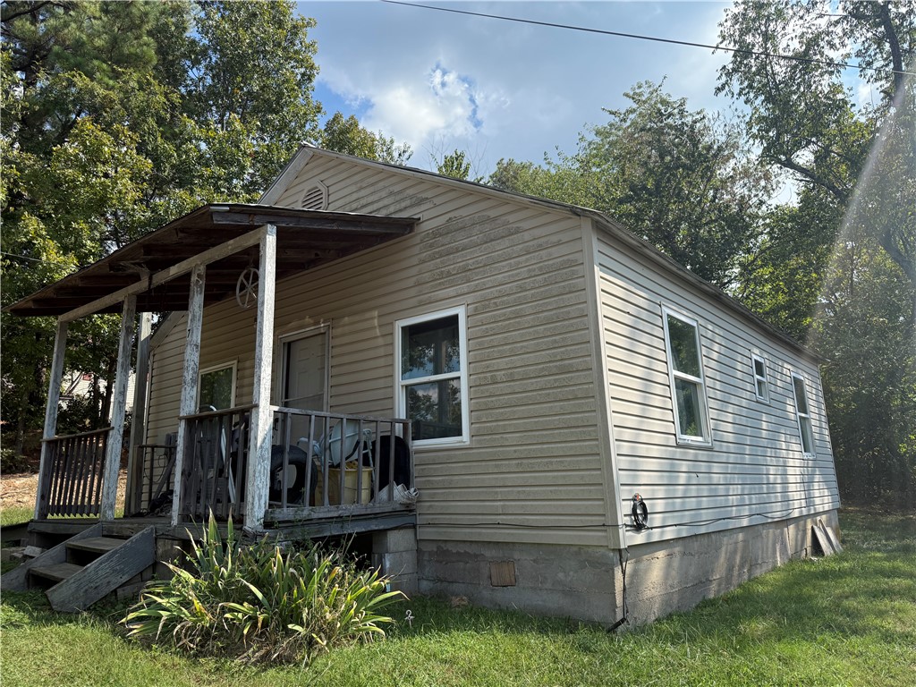 Investor special! This 2 bedroom, 1 bath home offers great potential as a rental or flip. Featuring vinyl siding, and a metal roof, this fixer upper is ready for your updates and improvements. Home currently has no heating or air system in place, all electric. Conveniently located in Marshall, this property is an affordable opportunity to build equity with some sweat equity and vision.