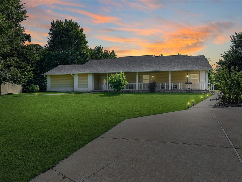 This large, single story, one-of-a-kind home is ideal for multigenerational living—offering peaceful country charm in the Bentonville school district. Centerton and Bentonville offer convenient shopping and dining, and XNA is just 20 minutes away. The smart layout includes two primary ensuite bedrooms AND dual living areas, providing privacy and flexibility for extended family, in-laws, or guests. A huge, tree-shaded front patio extends the living space outdoors—perfect for gathering, cooking, or relaxing. Set on a 1-acre lot outside city limits, there’s room for gardening, chickens, or simply enjoying the quiet. The garage and shed provide plenty of room for tools and toys, too. Don't miss this rare blend of space, comfort, and location—schedule your showing today!