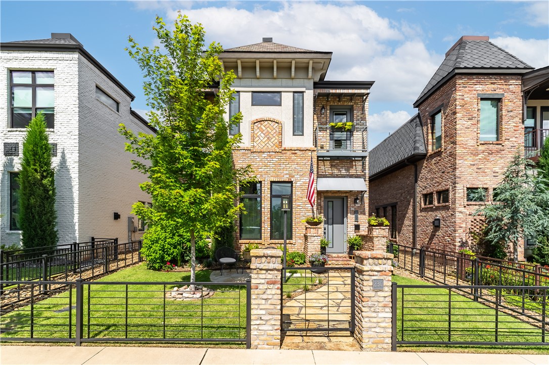230 SW D Street, located in the heart of downtown Bentonville. This 3,132sf home blends luxury & convenience, with 4 bedrooms & 3.1 baths. Built with authentic "Old Chicago" brick which exudes timeless charm. The main level features soaring 12-foot ceilings & expansive windows that fill the space with natural light. The state-of-the-art, freshly redesigned kitchen is a culinary dream, equipped with gourmet appliances, two ice machines, and custom bar. The primary bedroom & bath are conveniently located on the main level, providing a private retreat. Upstairs, offers three guest bedrooms, two full baths & media room.
Outside, enjoy the heated saltwater pool with a water feature and a serene courtyard, creating a private oasis. Complete with detached 2-car luxury garage.
Located just 3 blocks from The Downtown Bentonville Square, including the Crystal Bridges Museum of Art, the Momentary, extensive biking trails, and the city's top restaurants and shopping.