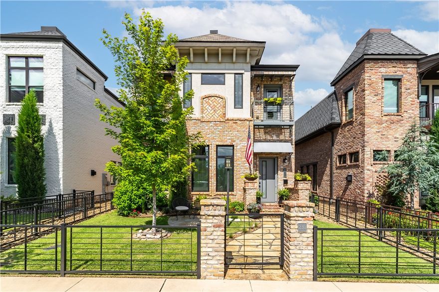 230 SW D Street, located in the heart of downtown Bentonville. This 3,132sf home blends luxury & convenience, with 4 bedrooms & 3.1 baths. Built with authentic "Old Chicago" brick which exudes timeless charm. The main level features soaring 12-foot ceilings & expansive windows that fill the space with natural light. The state-of-the-art, freshly redesigned kitchen is a culinary dream, equipped with gourmet appliances, two ice machines, and custom bar. The primary bedroom & bath are conveniently located on the main level, providing a private retreat. Upstairs, offers three guest bedrooms, two full baths & media room.
Outside, enjoy the heated saltwater pool with a water feature and a serene courtyard, creating a private oasis. Complete with detached 2-car luxury garage. 

Located just 3 blocks from The Downtown Bentonville Square, including the Crystal Bridges Museum of  Art, the Momentary, extensive biking trails, and the city's top restaurants and shopping.