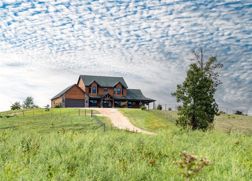 Welcome to this hobby farm with this stunning 5 BR, 4.5 Bath home nestled on 58+ acres of picturesque land. Built in 2016, this 2 story home with a basement & home office offers luxurious living with modern amenities.  The gourmet kitchen features custom cabinets, granite & top-of-the-line GE Profile appliances, refrigerator included. With 3 HVAC units for zone heating/cooling, comfort is guaranteed in every corner of this spacious 3835 sq ft home. The living room is a true centerpiece, boasting a stone wood burning fireplace, exposed beams, cathedral ceilings w/tongue & groove detailing & a wet bar for entertaining.  Outside, the beautifully landscaped grounds complement the homes charm, and with a great patio space providing the perfect setting for evening cookouts & relaxation. Embrace the incredible views that surround this property, offering a serene escape from the hustle & bustle of everyday life.  Don't miss the opportunity to make this dream home yours.