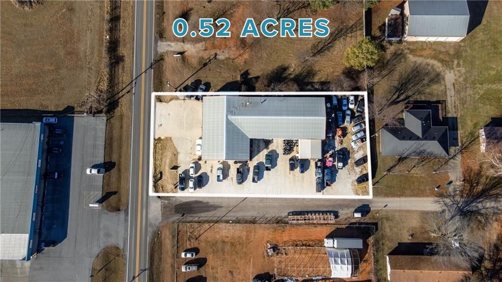 Beat the development rush!! PRIME opportunity to own a prime business location situated on highway 72 in Pea Ridge on a .52 acre lot. This 8,550 sqft property is tailored for an auto service center yet flexible enough for many different needs. Featuring 8 service bays (Two doors are 14' and 6 are 12'), a front reception area and 1,890 sqft of potential office space or storage on the second floor. The listing encompasses only the building and the land, with the business not included in the sale. Don't let this chance slip away to establish your business in a strategic and high-visibility location!