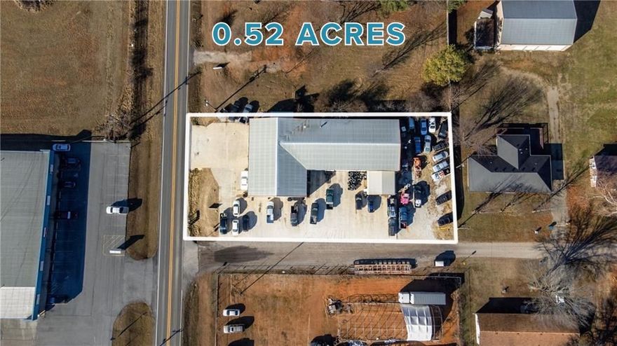 Beat the development rush!! PRIME opportunity to own a prime business location situated on highway 72 in Pea Ridge on a .52 acre lot. This 8,550 sqft property is tailored for an auto service center yet flexible enough for many different needs. Featuring 8 service bays (Two doors are 14' and 6 are 12'), a front reception area and 1,890 sqft of potential office space or storage on the second floor. The listing encompasses only the building and the land, with the business not included in the sale. Don't let this chance slip away to establish your business in a strategic and high-visibility location!