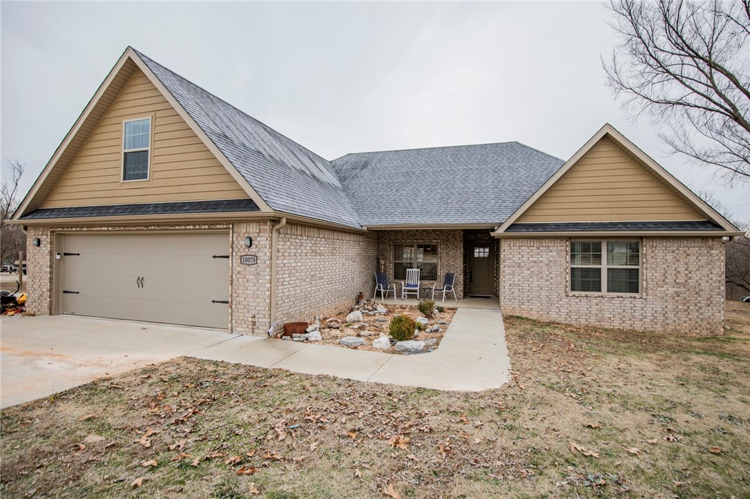 Discover a rare gem tucked away on 4.01 acres, offering the perfect balance of modern comfort and serene living. Built in 2021, this thoughtfully designed home features hardwood floors throughout the common areas, exuding warmth and elegance. True dining room, eat in kitchen in addition to a spacious kitchen island with seating. The versatile layout boasts two primary suites, providing exceptional comfort, along with an additional bedroom and bathroom on the main floor. A spacious bonus room on the second floor offers endless possibilities for a home office, playroom, or entertainment space. The split bedroom design ensures added privacy, making this home ideal for multi-generational living or hosting guests. Surrounded by natural beauty and located conveniently between the sought-after areas of Cave Springs and Elm Springs, this property is a must-see for those seeking both tranquility and outdoor space. Welcome HOME!