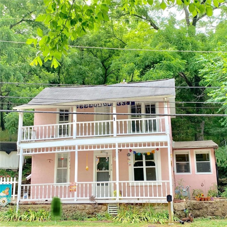 Come see this lovely Victorian two story house right on Main Street! Two front porches for sitting and watching the town go by. Small and cozy rear patio for a more private outdoor sitting looking out at the peaceful backyard. Fenced in rear area for pets. Nice tiered backyard for minimal yard work and parklike setting. Bonus rooms up and downstairs! Remodeled in 1970. Also zoned commercial.