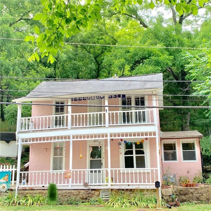 Come see this lovely Victorian two story house right on Main Street! Two front porches for sitting and watching the town go by. Small and cozy rear patio for a more private outdoor sitting looking out at the peaceful backyard. Fenced in rear area for pets. Nice tiered backyard for minimal yard work and parklike setting. Bonus rooms up and downstairs! Remodeled in 1970. Also zoned commercial.