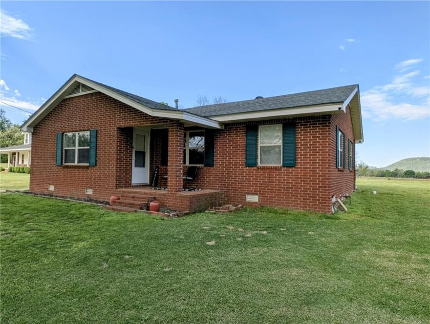 Small home with 1+/- acre:
This 1,310 sqft 3-bedroom, 1-bath home with office is situated on approximately 1 acre and offers charm, flexibility, and a private in-ground storm shelter for peace of mind. Ideal for rental income or a cozy primary residence, the home includes a spacious living area and a 2-car garage. Enjoy quiet surroundings just a half-mile from Paris High School and minutes from shopping, dining, and scenic recreation in the Ozark foothills. Other Listings associated with this property include MLS #'s 1305082, 1321295, 1321351.