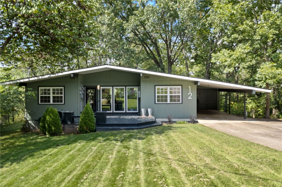 Beautiful remodeled home that backs up to the Tunnel Vision Bike Trail!!! This stunning 3bedroom, 2 bathroom house is perfect for anyone seeking a home in Bella Vista. This open-concept layout features vaulted ceilings, large windows, and new flooring throughout. The modern kitchen offers two-tone cabinetry, tile backsplash, and black stainless appliances. Enjoy the private backyard with mature trees, covered deck, and fenced areaāperfect for relaxing or entertaining. Conveniently located near lakes, golf, trails, and Bentonville schools.
