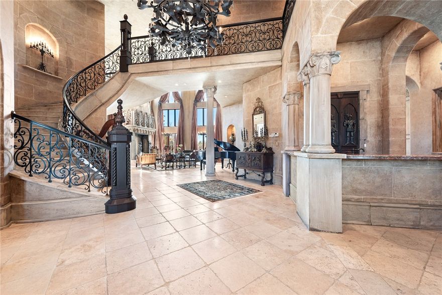 Exceptional and timeless French and Swiss influenced Manor built upon a one-half acre site boasting AMAZING views in all directions with multiple balconies and verandas overlooking the 12th, 14th and signature 15th island holes of the prestigious Pinnacle Country Club. Constructed of concrete and steel, this energy efficient estate was built to endure generations to come and features 10,341 sq ft of living space. From the aged travertine and hand scraped wooden floors to the handmade interior doors and imported slate roof, this spectacular estate stays true to the Old World style and evokes a sense of grandeur with a warm and inviting touch! Arranged over 4 floors featuring 5 bedrooms, 5 full & 2 half baths and grand and luxurious rooms perfect for entertaining including a library, exercise room & full media room. Almost 2,000 sq ft of unfinished walk-out basement space offers a blank slate with great possibilities. Just minutes from high-end retail, restaurants, Walmart Amp, Top Golf, medical facilities and I-49.