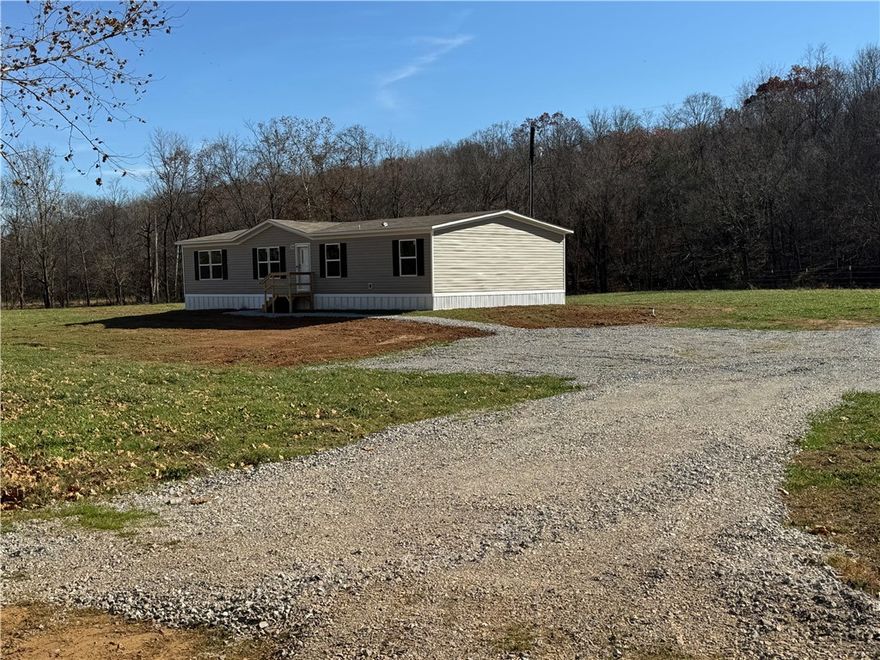 Discover peaceful country living with modern comfort at this newly set double-wide manufactured home nestled on 5 beautiful acres in Huntsville, Arkansas. This property blends open pastureland with a touch of woods, offering both usable land and natural privacy.Brand New Double-Wide Home – Move-in ready with modern finishes and efficient layout.

5 Acres – A great mix of pasture for animals or gardening and woods for shade, privacy, or recreation.

Fresh Infrastructure

New Well

New Septic System

Electric Installed

Internet Available

Natural Water Feature – A creek runs through the property, adding charm and potential for outdoor enjoyment.

Country Living with Modern Utilities – Enjoy high-speed internet and reliable utilities while still having privacy and space.