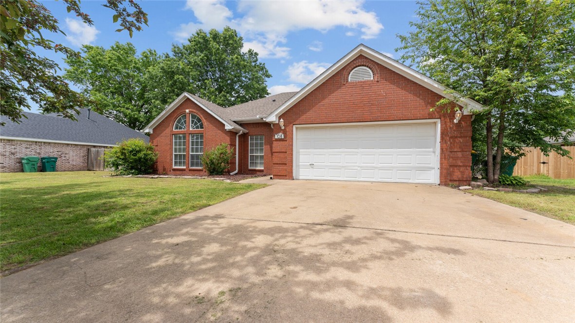 Welcome to this beautifully updated 4-bedroom, 2-bathroom home located in the highly desirable Bentonville School District. This home features a spacious, split floor plan with vaulted ceilings and an abundance of natural light in every room. The freshly painted interior and brand new carpet give the home a fresh, modern feel. The inviting living room is complete with a cozy gas fireplace, perfect for relaxing on cooler evenings. The home also boasts a large, flat, fenced-in backyard, ideal for outdoor activities or gatherings. Located just 3 minutes from the upcoming Walmart Supercenter and 6 minutes from the high school, this home offers convenience at its finest. You’re also just 2 minutes from the city park, offering endless opportunities for outdoor enjoyment. The roof and HVAC were replaced in 2020, ensuring peace of mind for years to come. With its all-brick exterior and exceptional location. Come see and make it yours!