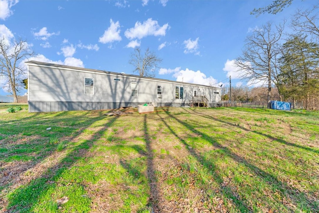 BACK ON THE MARKET! Spacious, 2015-model manufactured home with over 12 peaceful, secluded acres outside the city limits with convenient access to AR-102. You'll love the home's easy floorpan, open kitchen, natural light and wooded views. The property is a quick drive to the Oklahoma border and neighboring cities Decatur, Gravette and Gentry and within a twenty-five minute drive to Centerton. With utilities onsite, this property is perfect for a private estate, recreational retreat or hobby farm. Assumable FHA loan (subject to borrower and loan approval requirements).