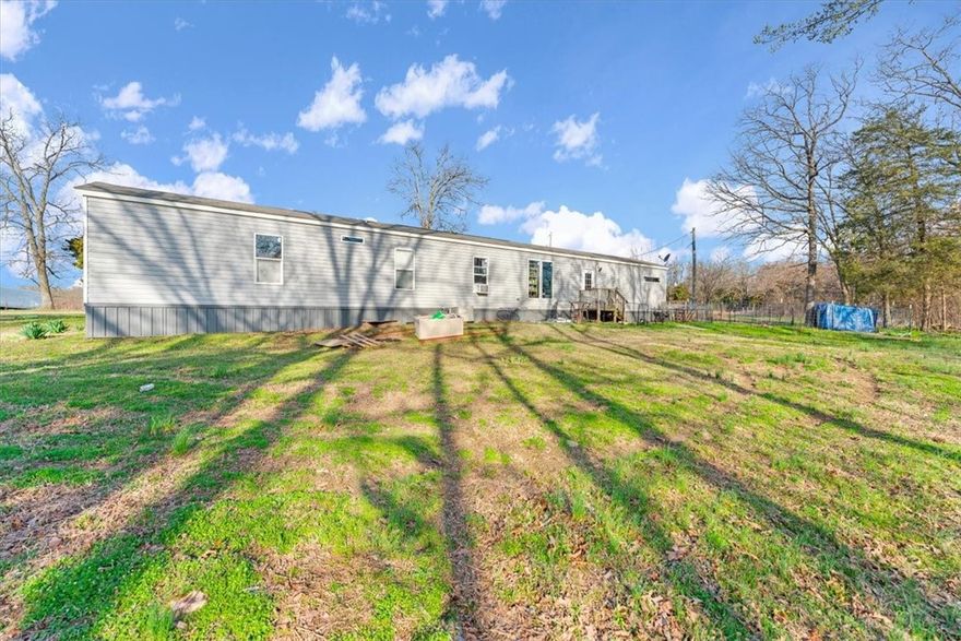 BACK ON THE MARKET! Spacious, 2015-model manufactured home with over 12 peaceful, secluded acres outside the city limits with convenient access to AR-102. You'll love the home's easy floorpan, open kitchen, natural light and wooded views. The property is a quick drive to the Oklahoma border and neighboring cities Decatur, Gravette and Gentry and within a twenty-five minute drive to Centerton. With utilities onsite, this property is perfect for a private estate, recreational retreat or hobby farm. Assumable FHA loan (subject to borrower and loan approval requirements).