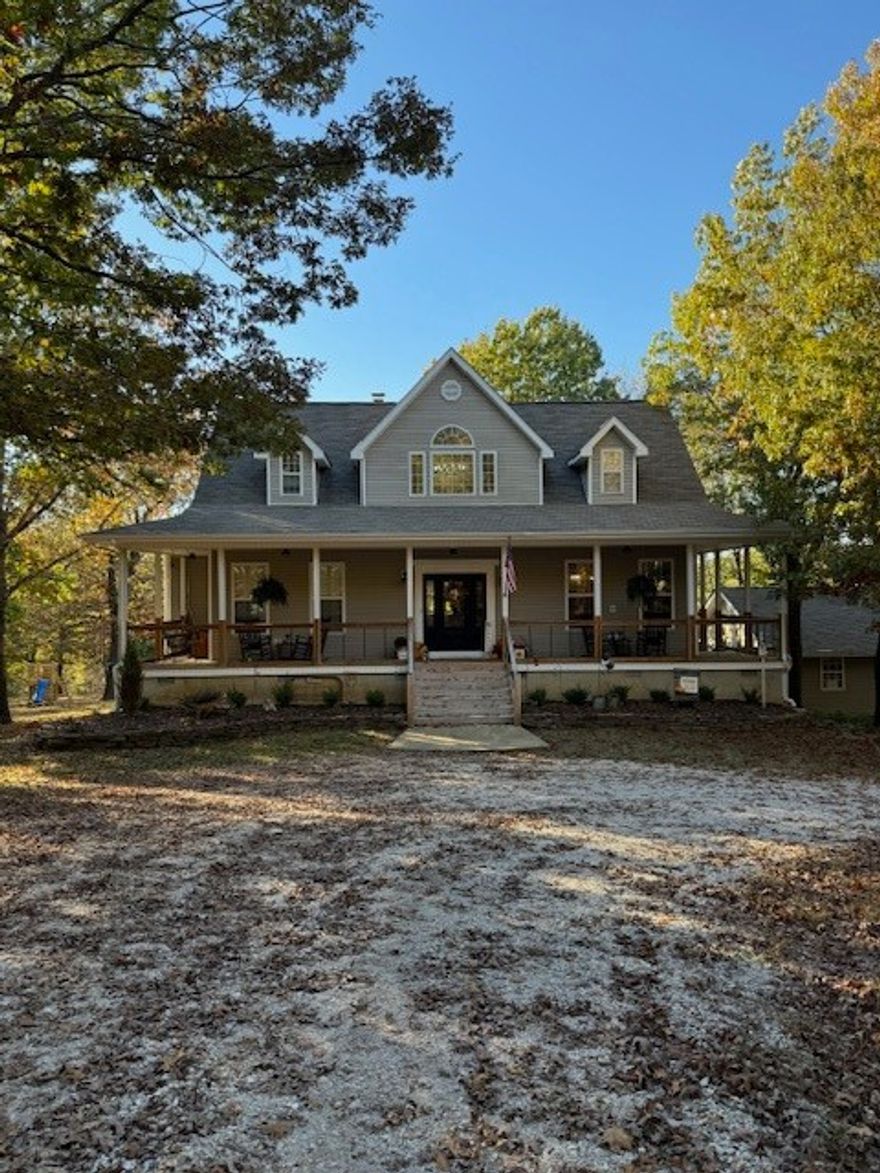 Fabulous 3 level, 3842 SF home nestled on 7.1 +/- private and wooded acres. This property is set up to entertain family and friends with multiple manicured outdoor living spaces. The stunning front porch wraps around to the sides of the home. Rock or swing away while the wildlife play! The main 2,365 SF house boasts 4 BR and 3 BA. The 1,477 second living space on the lower level has 2 BR, 2 BA & is handicap accessible. Both have open living/kitchen areas. Main living room has a wood burning fireplace, many picture windows to allow for lots of natural light, Blue Tooth audio system, storage galore, newly updated and elegantly finished. Outdoors you have a 2-car detached garage, shed with lean-to and a new shop with mounted air and dust fans, 220 electric, dust vac. Amenities list to come soon. It is a MUST SEE!