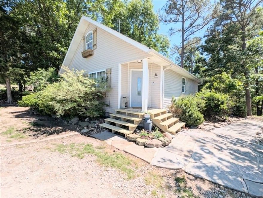 Nestled on 1.37 scenic acres, this inviting 3-bedroom, 2-bath country home offers the perfect balance of privacy, space, and convenience. Located just 15 minutes from both Branson and Harrison, enjoy peaceful country living with easy access to shopping, dining, and entertainment.From the moment you arrive, you'll love the secluded setting and breathtaking valley views. The well-designed split-bedroom floor plan gives privacy to the spacious primary suite while keeping the other bedrooms on the opposite side. The 25' x 14' bonus room features a private upstairs office that can serve as a home office or a flexible fourth bedroom—perfect for a family room, playroom, or guest suite. A 40'x 40' metal shop with electricity and a 14-foot roll-up door is ready for hobbies, storage, or business. If you're looking for room to grow in a beautiful, private setting, this could be the one.