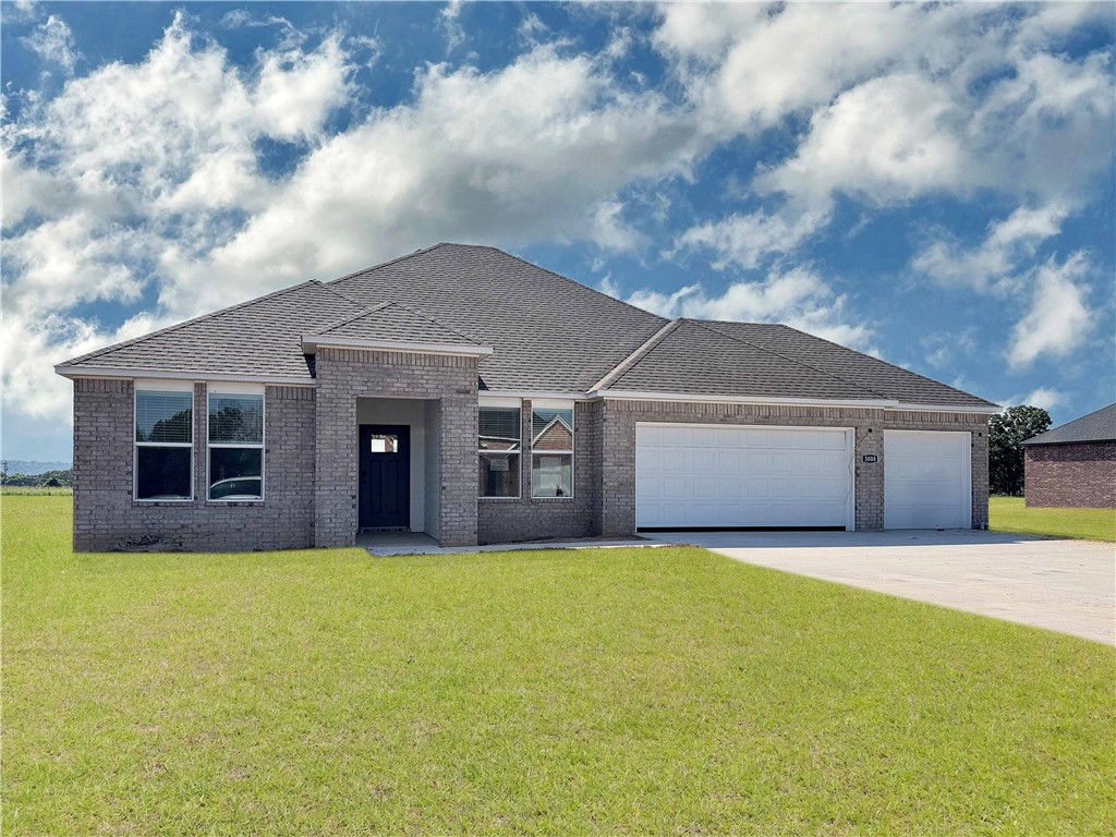 Wonderful Warren plan with a 3-car garage in Monitor Meadows, where you'll experience modern luxury in Springdale, Arkansas. Our meticulously crafted floor plans provide ample space for you to grow and thrive. Beautiful Quartz countertops in the kitchen with tile backsplash and 42-inch upper cabinets. Oversized island per plan. Black plumbing fixtures throughout! LED lighting throughout! Ceiling fan in the living room and bedrooms! Living room will have and a modern electric fireplace with a poplar mantle. Bedroom 1 has a fabulous ensuite with an oversized walk-in shower with tiled walls, elongated commode and quartz countertops with dual sinks. Back door is a full lite glass with mini blinds. Approximately 1 acre lots!!