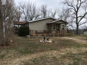 2BR/1BA Mobile with detached, 2-car garage, sitting on 20 acres with amazing views of the Ozark Mtn. hillsides! Great location between Harrison & Omaha!
