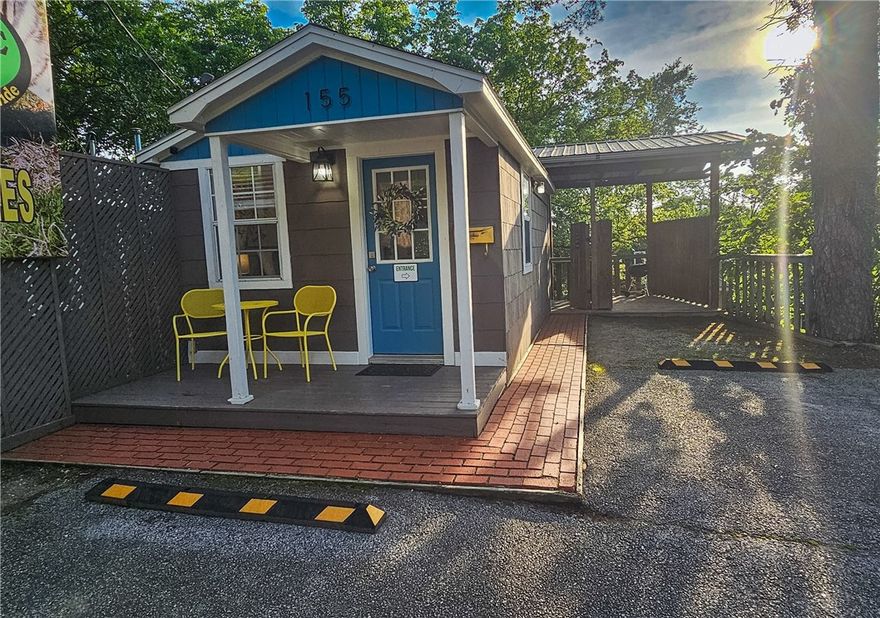 Recently remodeled Flexible residential, commercial or nightly rental use in a high visibility, easy access location with parking 1/4 mile from Historic Downtown Eureka Springs! 2 levels of charm, stunning vistas from back covered decks with covered walkways and parking slot. Very cozy, updated interiors in MCM style. AND, it comes with an onsite Billboard to use for your own purposes or rental income. Short walk to the community center, farmers market and trolley/transportation center. This is truly a MUST-SEE unique opportunity.