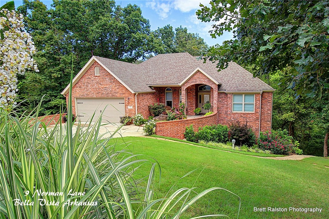 2008 home with high ceilings, crown molding, & open floor plan. Beautiful landscaped with fire pit on extra lot. Shop in lower level with overhead door for all your toys & tools. All large rooms, good flow & design. Wonderful kitchen with 2 ovens, pantry & granite counter tops. Great views of woods from Sunroom. Lower level finish added to the sq.ft. that shows on county records. Covered deck and patio. Large home for a big family or for entertaining. The heated and cooled shop is not included in the Sq. Ft. on listing.