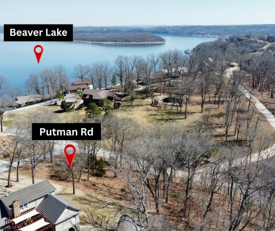 Imagine waking up every day to a stunning lake view in your dream home! This spacious corner lot, nestled in a picturesque lakeside subdivision, offers an ideal setting for your future residence. Just a quick drive from the vibrant Rogers Downtown District and the serene Prairie Creek Marina, you'll have the perfect balance of tranquility and convenience. Create your own oasis in this thriving community and make every day feel like a getaway!