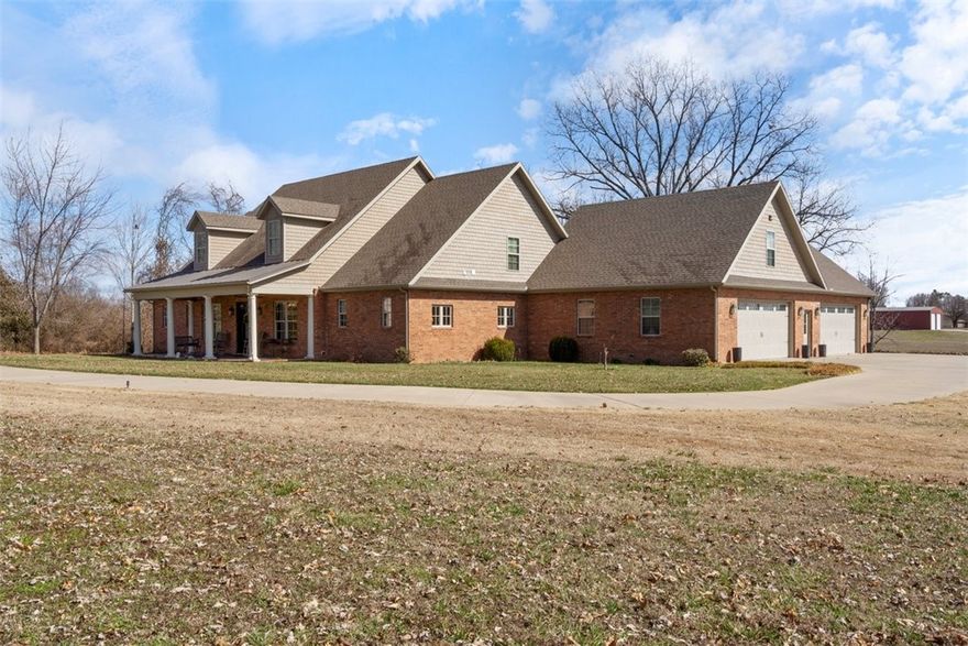 Custom Farmhouse Retreat on 3.3 Acres.  
Experience the perfect blend of farmhouse charm with modern sensibilities in this stunning Tidewater Farmhouse architectural style estate. Nestled back off street on 3.3 serene acres, this countryside sanctuary offers privacy while keeping city conveniences within reach.  
Expansive windows fill the open living space with natural light, framing picturesque views of your private haven. The 3,371 sq. ft. main level boasts 10' ceilings, and three luxurious bedroom suites, including a spacious primary retreat. The upstairs 911 sq ft Wing includes two generous bedrooms, ensuite for guests. As a bonus, cleverly designed storage is everywhere.  
Step outside to covered porches, perfect for morning coffee or evening gatherings. A custom, heated four-car side-entry oversized garage with added amenities.  The setting is a quiet, private retreat yet minutes from everything.    
This is more than a home—it’s a refined retreat where timeless charm meets modern sensibilities.