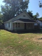 Cozy 2 bedroom located near the university of the ozarks, real hardwood floors throughout home, , has had some recent updates with plumbing and electric, has nice sized fenced back yard and a storage building next to house