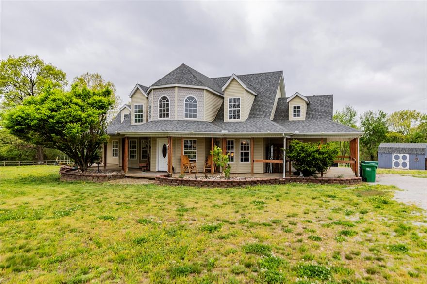 Horses are in the back fenced area for showings. Barn conveys with acceptable offer. If your buyer doesn't need the horse fencing and barn, seller can remove prior to closing. Chicken houses on land behind are inoperable and said to be removed in the near future. Spacious 4-bedroom home built in 2002 on 5 acres of 95% flat, picturesque land. Features an office, sunroom, and formal dining. Ideal horse hobby farm with barn and fully fenced acreage. Enjoy a wraparound porch with breathtaking views. Private country feel just minutes from town. Updates include roof (2022), A/C units (2021 & 2023), and water heater (2017).