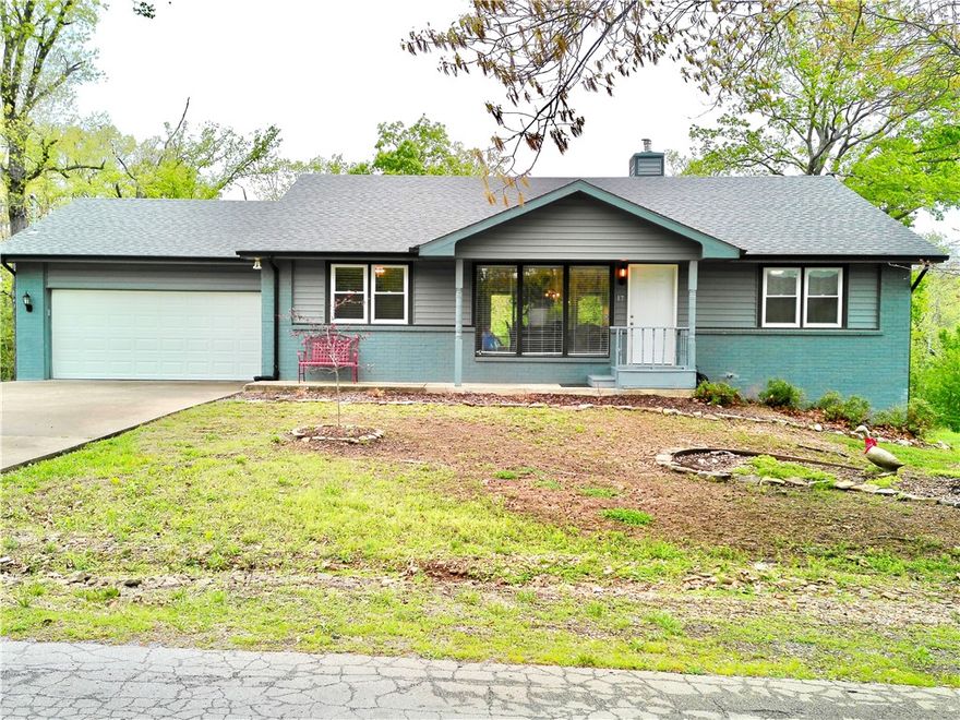 Stunning Home Near Lake Loch Lomond! Welcome to this beautiful home tucked away on a quiet cul-de-sac, just moments from Lake Loch Lomond—one of the area’s most sought-after lakes. This 4-bedroom, well-designed living space with a desirable split floor plan and an open-concept layout perfect for both everyday living and entertaining. The spacious kitchen features a large island, ample cabinetry, and flows seamlessly into the main living area, with a wood-burning fireplace. Step outside to a huge back deck, partially screened-in, creating the perfect space! The primary suite includes a beautifully finished bathroom with a marble vanity and stone tile flooring. Enjoy all the incredible Bella Vista amenities, including pools, hot tub, sauna, tennis courts, pickleball, golf courses,  and more. making this an ideal spot for outdoor enthusiasts. 5 minutes from Highway 49, Gravette School District!