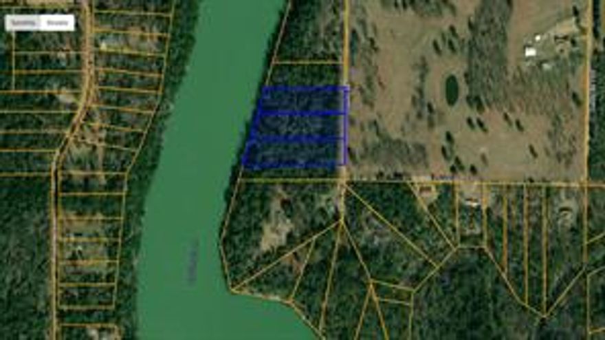 3 Acres featuring a stunning panoramic bluff view of the shimmering water below.
Flexible Owner Financing to purchase the entire 3 acres or to purchase individual lots 
at $25,000 each.