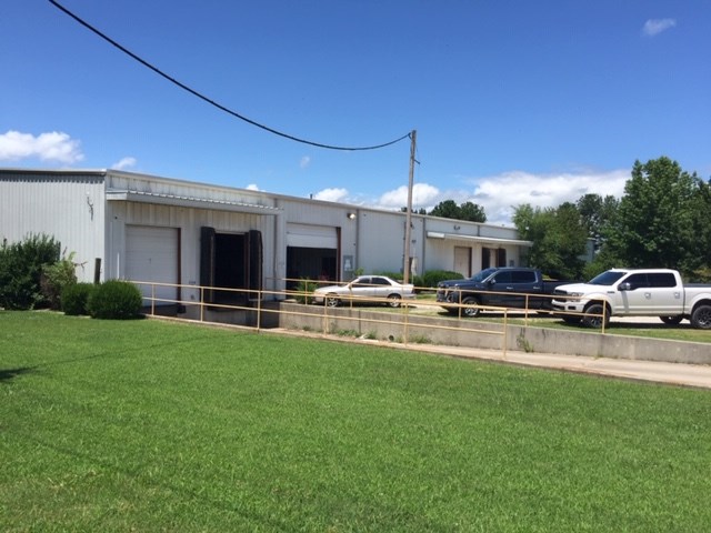 Warehouse/Industrial property for sale. Heated warehouse, easy access to I-49. Property has an alarm system. 4 dock high doors and 1 roll up door. 16' - 20' ceiling height.