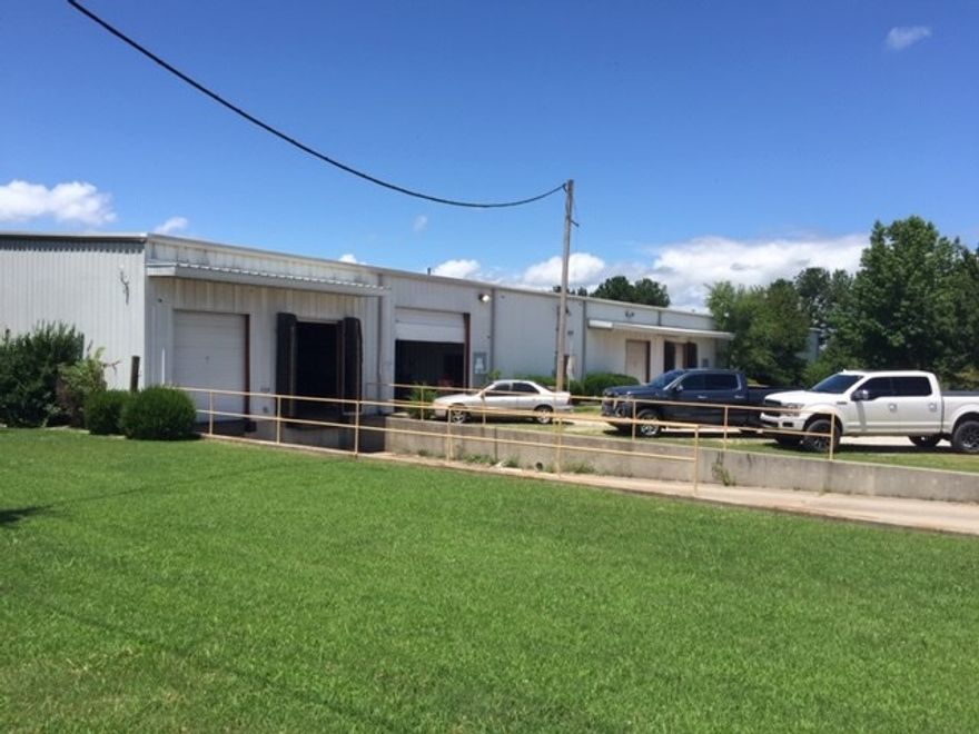 Warehouse/Industrial property for sale.  Heated warehouse, easy access to I-49.  Property has an alarm system.  4 dock high doors and 1 roll up door.  16' - 20' ceiling height.