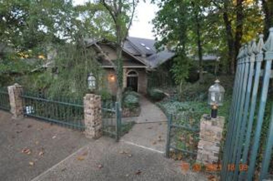 Large Home on 3 Acres. This home has endless possibilities. 300 feet on the Lake Shoreline, Great home for entertaining with all the room you will ever need. Custom made cabinets and custom woodwork throughout the house. The 4 car garage with full length work shop under the garage. 6182 square Feet does not include partially finished basement    Boat Dock, Swimming Pool on the property with Golf course in the subdivision.