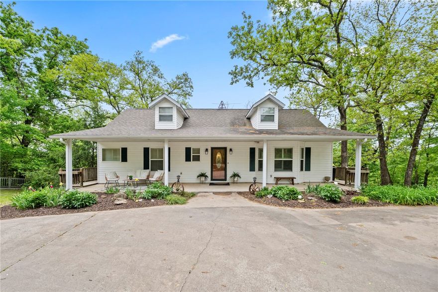 Enjoy private riverfront living on 7 secluded acres with direct water access and sweeping views. This fully renovated 3-bed, 3-bath home offers 2,704 sq ft of move-in-ready living with fresh interior paint of walls and trim, doors and new hardware, new carpet, LED lighting, updated light & plumbing fixtures throughout, and exterior ceiling fans for outdoor living comfort. The open-plan kitchen features a central island, quartz countertops, subway-tile backsplash, & all-new stainless appliances including range, dishwasher, side-by-side refrigerator & beverage fridge—perfect for entertaining. The updated primary bath is a spa-like retreat with double vanity, walk-in shower & large soaking tub w/whirlpool jets. Primary bedroom offers direct exterior access to deck for easy indoor-outdoor living. Walk out basement offers more indoor/outdoor space for family games & entertainment. Oversized 2 car detached garage/shop. Stairs/Trails down to the water! Plenty of open ground for gardening & play. Rural Water coming soon.