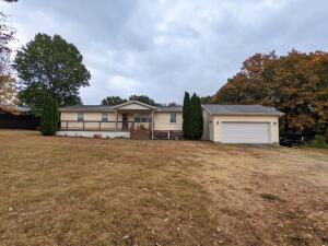 What a great location and beautiful country setting on the outskirts of town with huge living room, open concept, gas fireplace, near level wonderfully landscaped yard, large front porch & detached 2 car garage on 1.02 acres, m/l. Move in ready with additional office space. View the Virtual Tour at:All #s are approx., age is estimate, square footage per assessor.