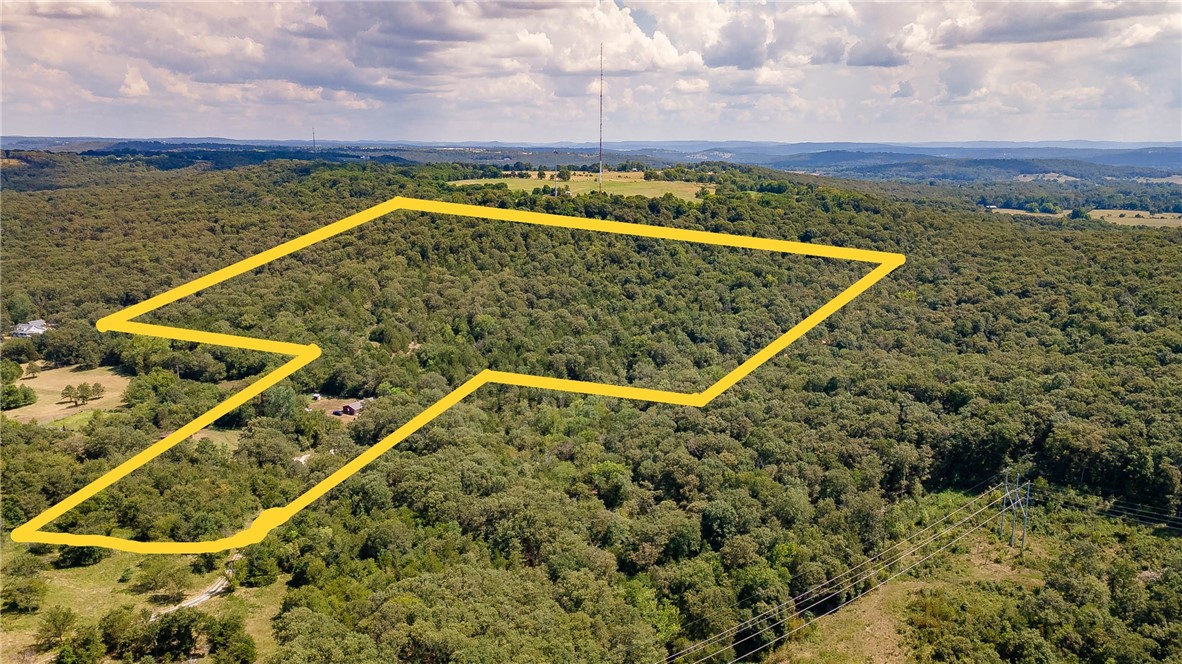 40.5± Acres Near Beaver Lake – Your Country Retreat Close to Goshen & FayettevilleEscape to 40.5± acres of serene countryside just minutes from Beaver Lake and the town of Goshen. With rural water and electric available, this property offers the perfect setting for a private home, a recreational retreat, or a combination of both.Enjoy the peace and privacy of wide-open spaces with room to build, explore, and even hunt on your own land. Yet you’ll remain conveniently close to Fayetteville, schools, and local amenities—perfectly blending country charm with modern convenience.This is more than land; it’s a canvas for the lifestyle you’ve always wanted. Older 2 bedroom 1 bath 1 car garage home on site. You could live here while building your dream home or use as a rental. Also listed as MLS 1318990 a 2.65 acre lot MLS 1318997 a 35 acre lot MLS 1319008 a 3 acre lot with th home