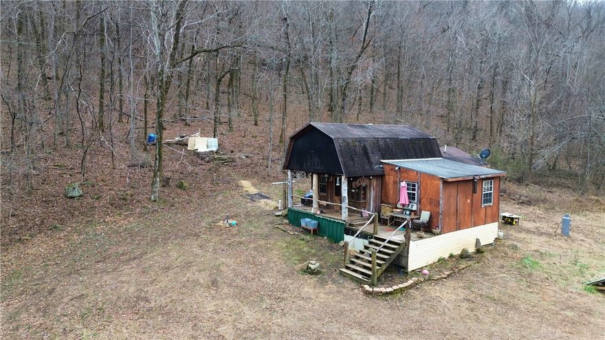 Escape to true freedom with this charming 900 sq. ft. off-grid cabin nestled on 10 private, wooded acres, just minutes from the National Forest. This secluded property is perfect for those seeking peace, privacy, and a self-sufficient lifestyle. Surrounded by nature, the land is teeming with wildlife, offering incredible opportunities for hunting, hiking, and outdoor recreation right outside your door. Whether you’re looking for a full-time off-grid residence, weekend getaway, hunting cabin, or homestead, this property delivers unmatched serenity and natural beauty. If you’ve been dreaming of unplugging and living closer to the land, this rare off-grid opportunity is ready for you.