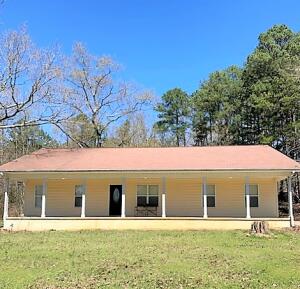 Country cottage charmer tucked in the middle of 4 acres, within minutes to Wal Mart and all of the Village amenities, but wooded lot for a private setting. 2 bed and 2 baths with just under 1900sqft fully equipped with accessible features.