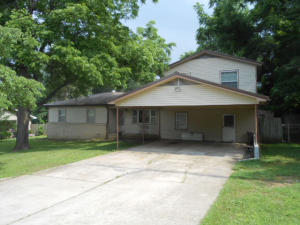 Large home on dead end street. Great for playing children. 4 Bedrooms, 2 Living areas, Huge master suite with balcony, covered back porch, shed, oversized carport. Big house for the money. Backs up to large field for that country feeling. Upstairs bedroom was added in the 1990's.